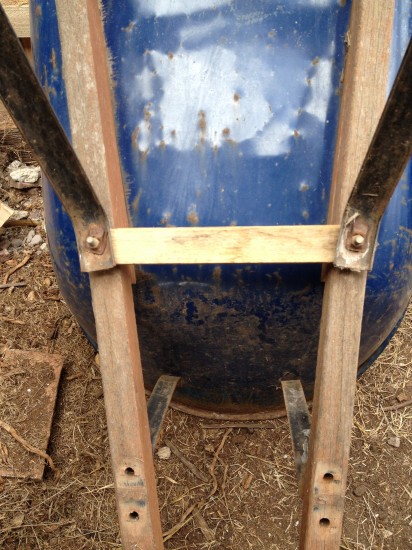 Repaired brace fitted back on wheelbarrow