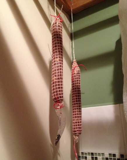 Salami hanging in laundry